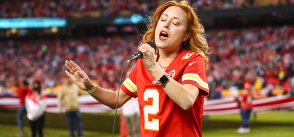 Casi Joy singing “God Bless America” at halftime during an NFL football game against the Dallas Cowboys, Sunday, November 21, 2021 in Kansas City.