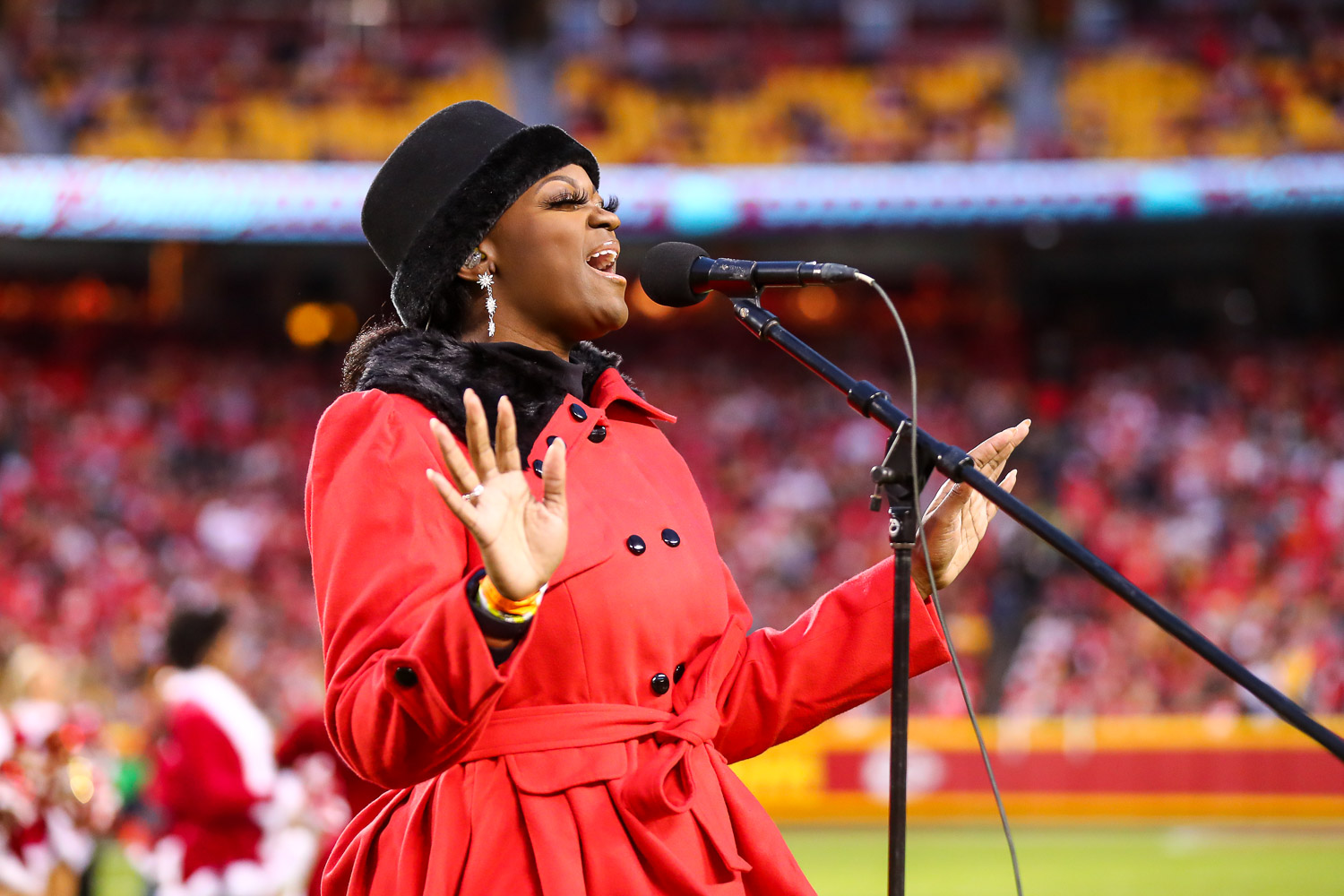 Singer/songwriter Symonne Sparks sings a holiday medley at halftime during an NFL football game against the Pittsburgh Steelers, Sunday, December 26, 2021 in Kansas City.